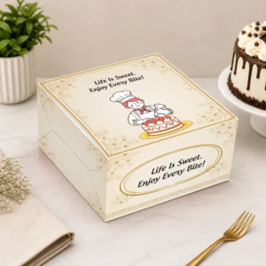 Premium cake box packaging design template with elegant pink bakery artwork, cute chef illustration, and professional cake packaging mockup by Lakshay Design.